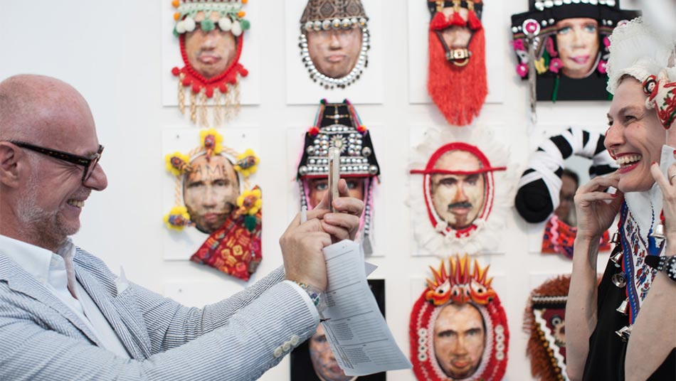 Guests interacting with Shay Tako's masks 