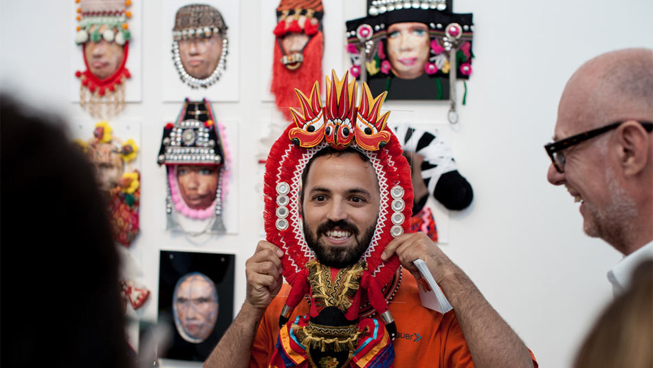 Guests interacting with Shay Tako's masks 