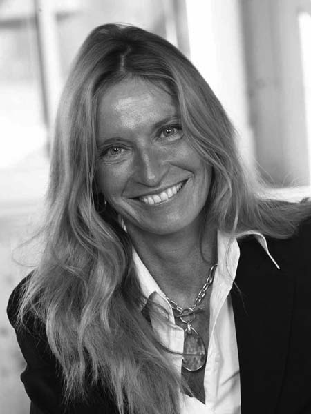 a black and white photo of a woman smiling