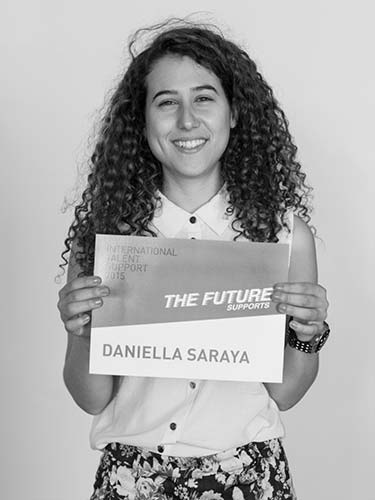 a woman holding a sign that says the future danielle saraya