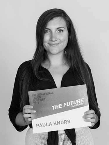 a woman holding a sign that says the future