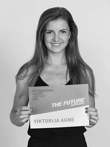 a woman holding a sign that says the future