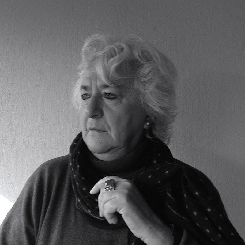 a black and white photo of an older woman