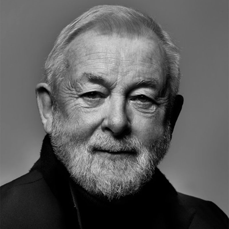 a black and white photo of a man with a beard