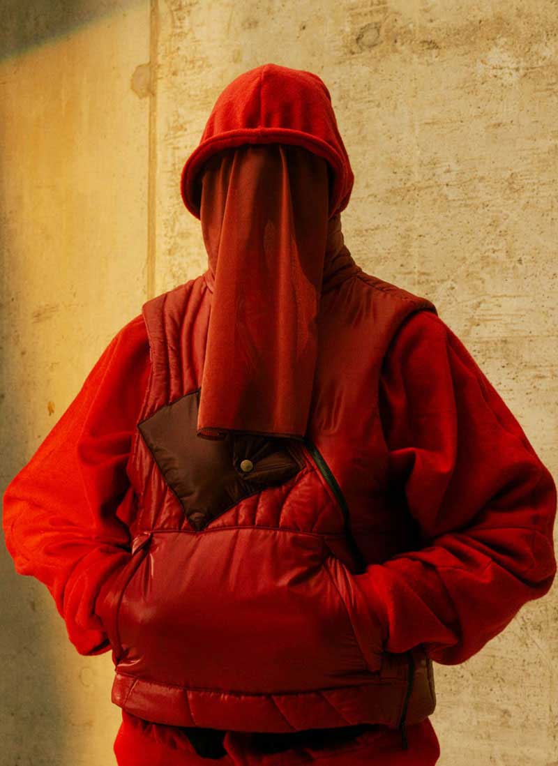 a person in a red jacket and a red hat