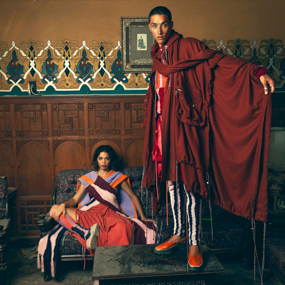 a man and a woman sitting on a couch in a room