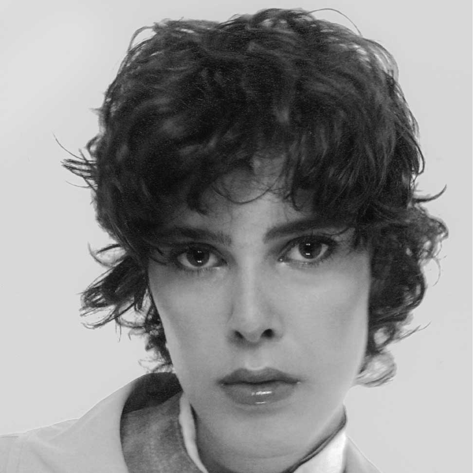 a black and white photo of a woman with curly hair