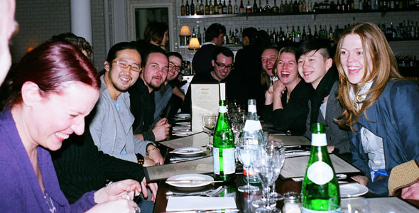 a group of people sitting around a table